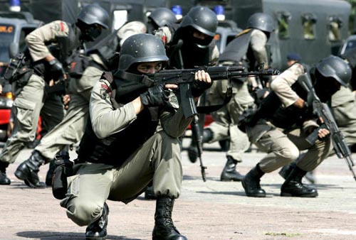 Indonesian anti-terror police unit show their skills during a security drill